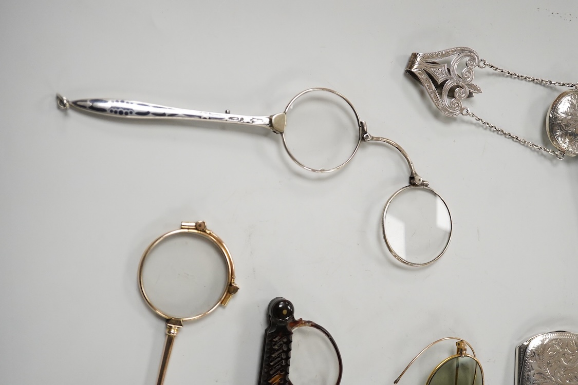 An Edwardian engraved silver spectacle case, by Boots Pure Drug Company, Chester, 1903, one other engraved silver spectacles case, hallmarks rubbed, a pair of 830 standard white metal and niello lorgnettes, two other pai